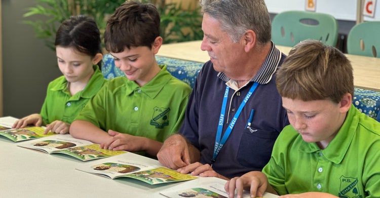students working with a teacher