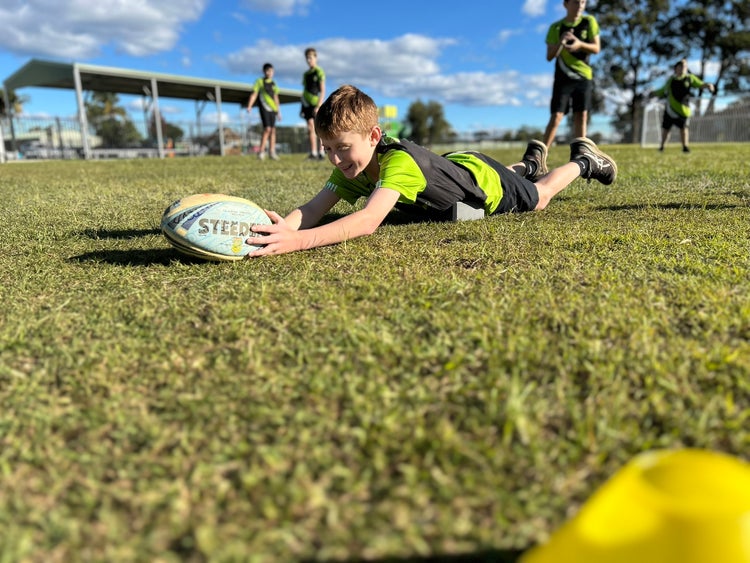 Students playing touch football